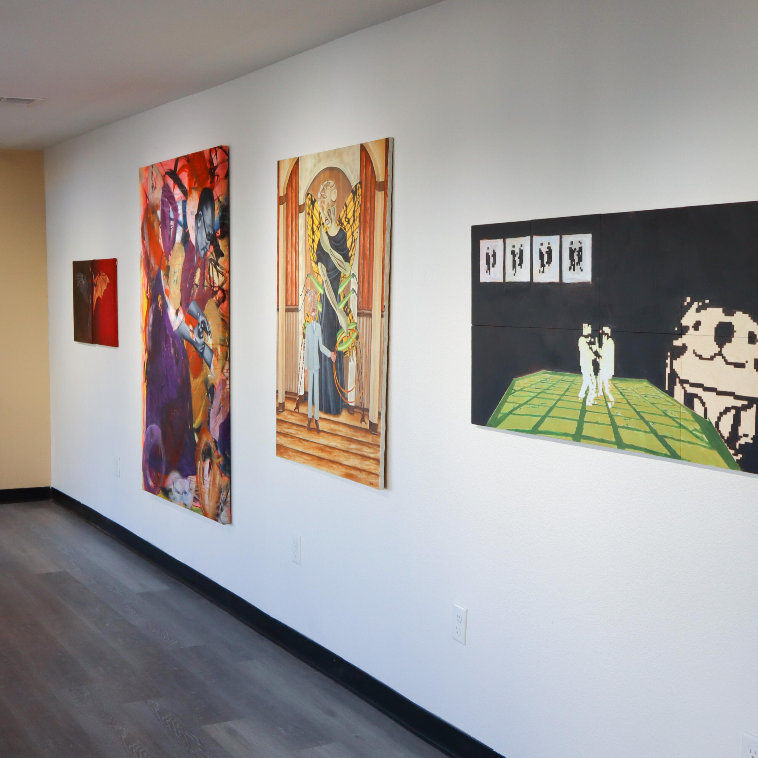 Image of a sunny, bright day in the desert of Nevada. There is a mountain in the horizon line and beneath it is a large desert landscape full of shrubs and yellow grass.