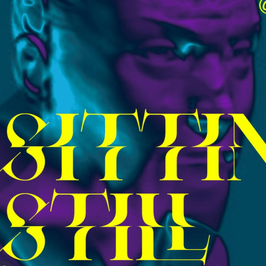 Image from Stone Soup event from 2023 Desert Biennial Project. Features bright orange diamond sign with black lettering spelling out Desert Biennial Project behind a sign made from dimensional lumber with Stone Soup painted in red on front of sign.